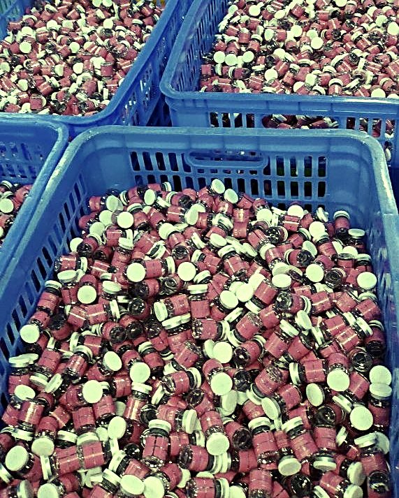 Baskets of finished jars ready for packing
